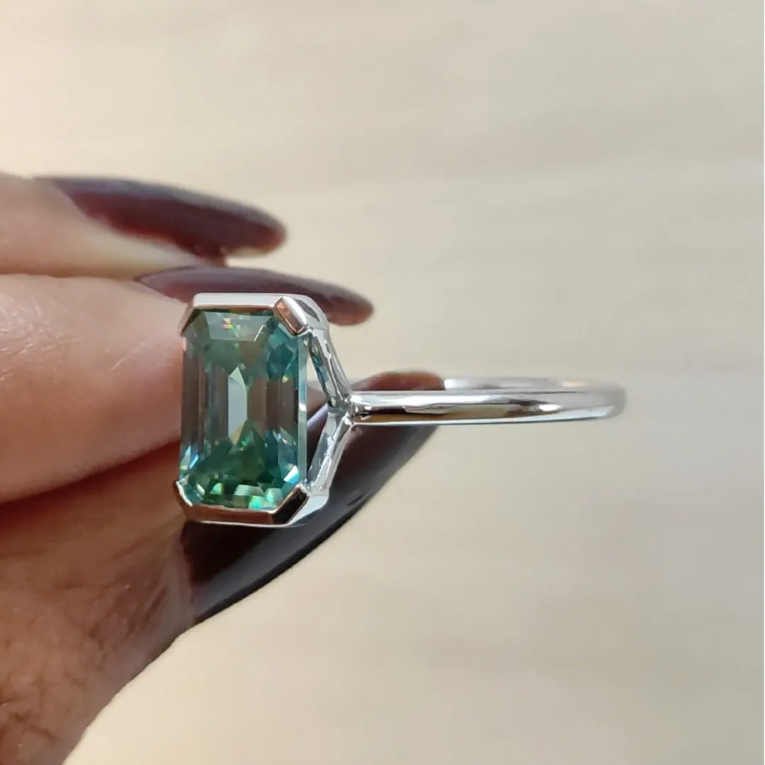 /public/photos/live/Blue Green Emerald Half Bezel Set Moissanite Solitaire Ring 652 (2).webp